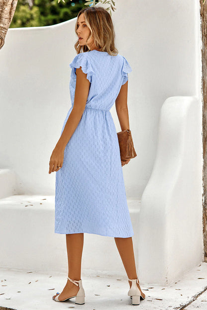 Luchtige Zomerjurk met Elegante V-hals en Subtiele Ruches
